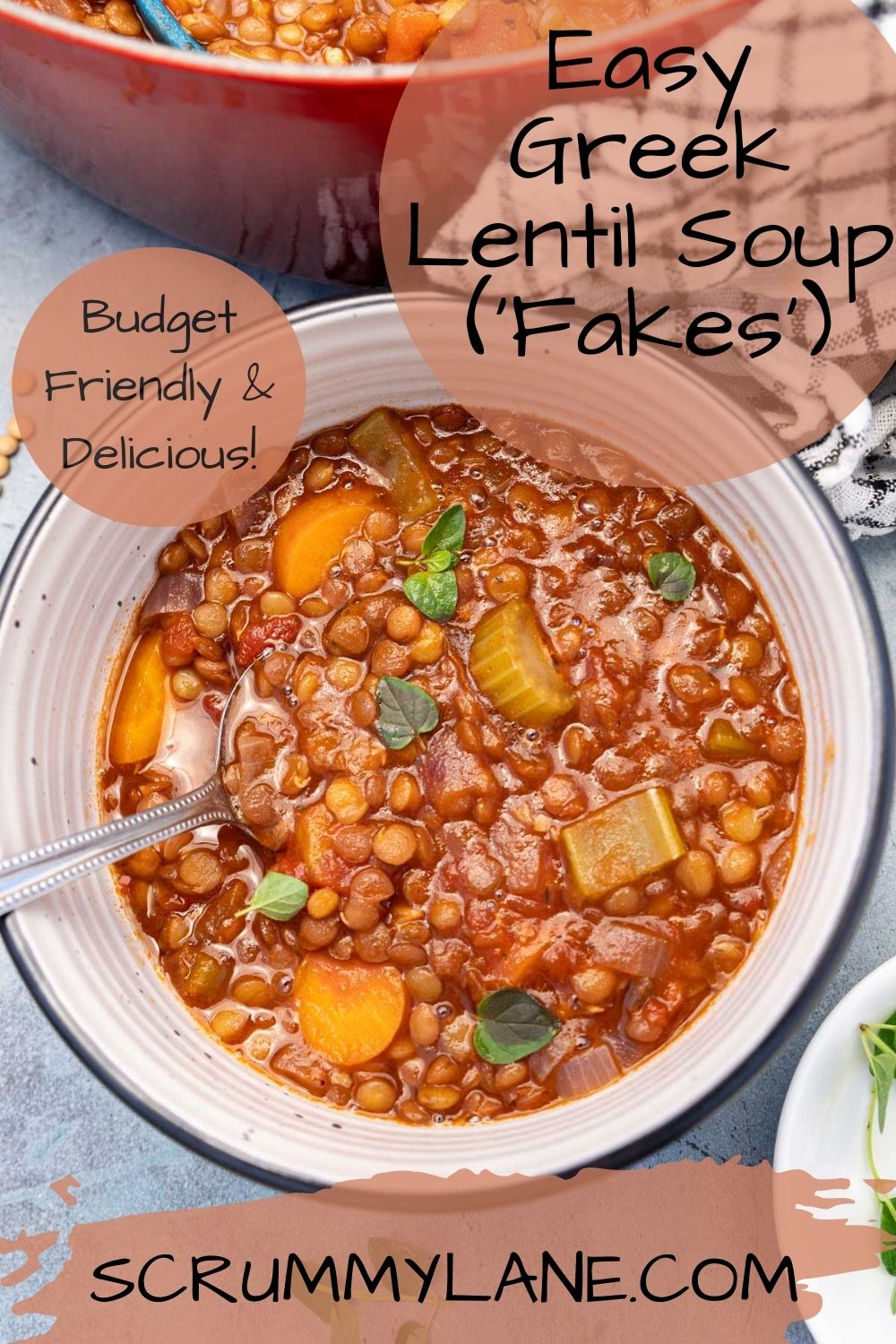 A dish of Greek lentil soup with a spoon in it on a blue background with a title on it for Pinterest.