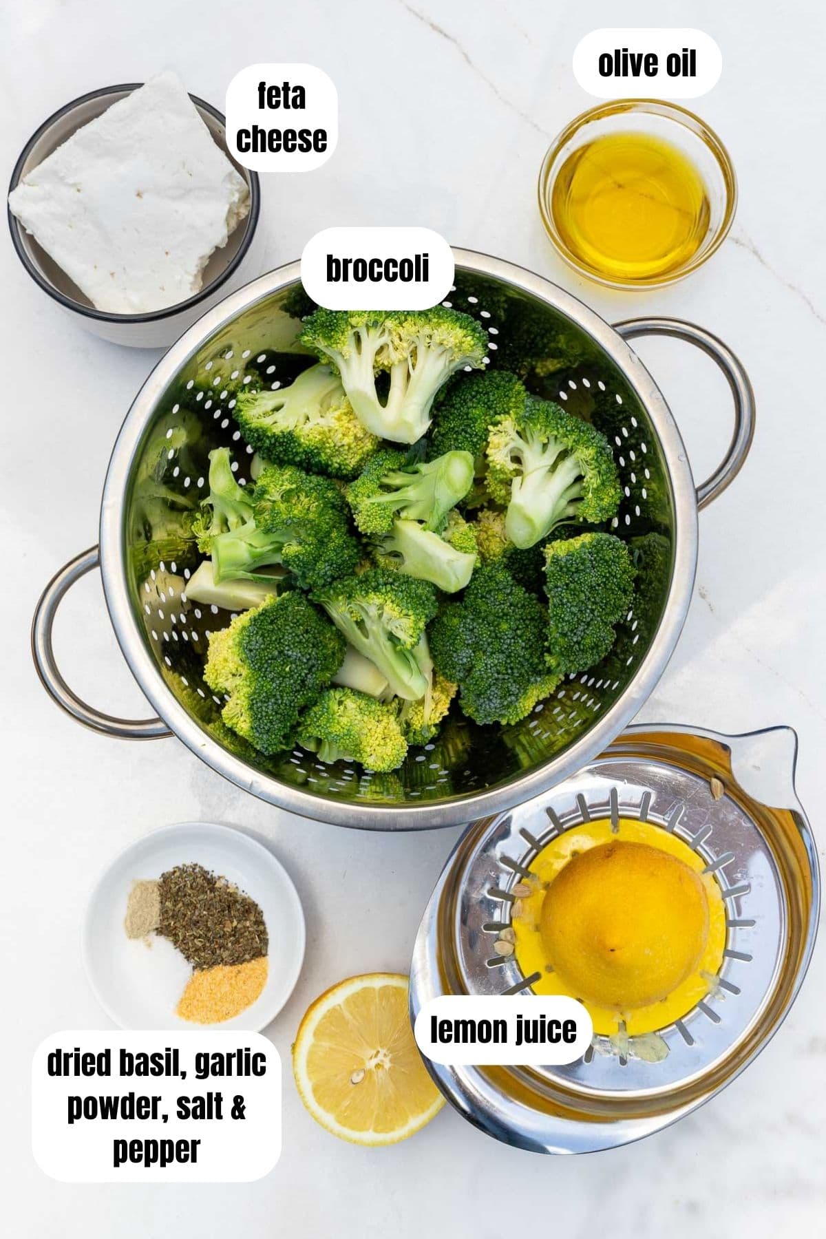 A collage of all the ingredients needed to make smashed broccoli with feta, including broccoli, feta cheese, olive oil, dried basil, garlic powder, salt and pepper, and lemon juice, labelled.
