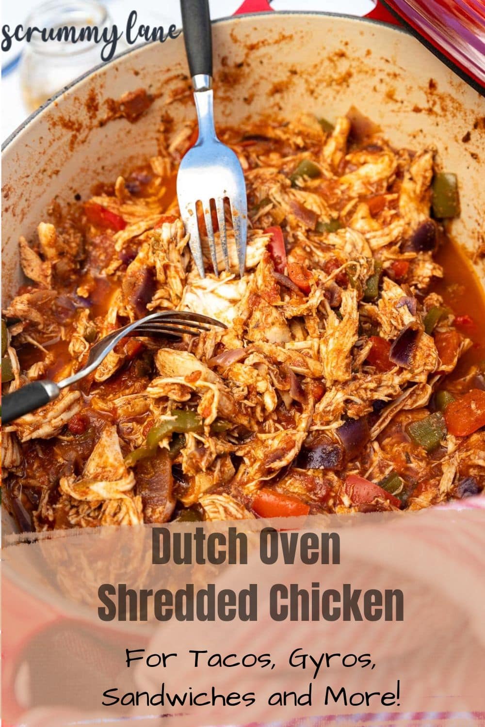 Shredded chicken and two forks in a red dutch oven with a title on it for Pinterest.