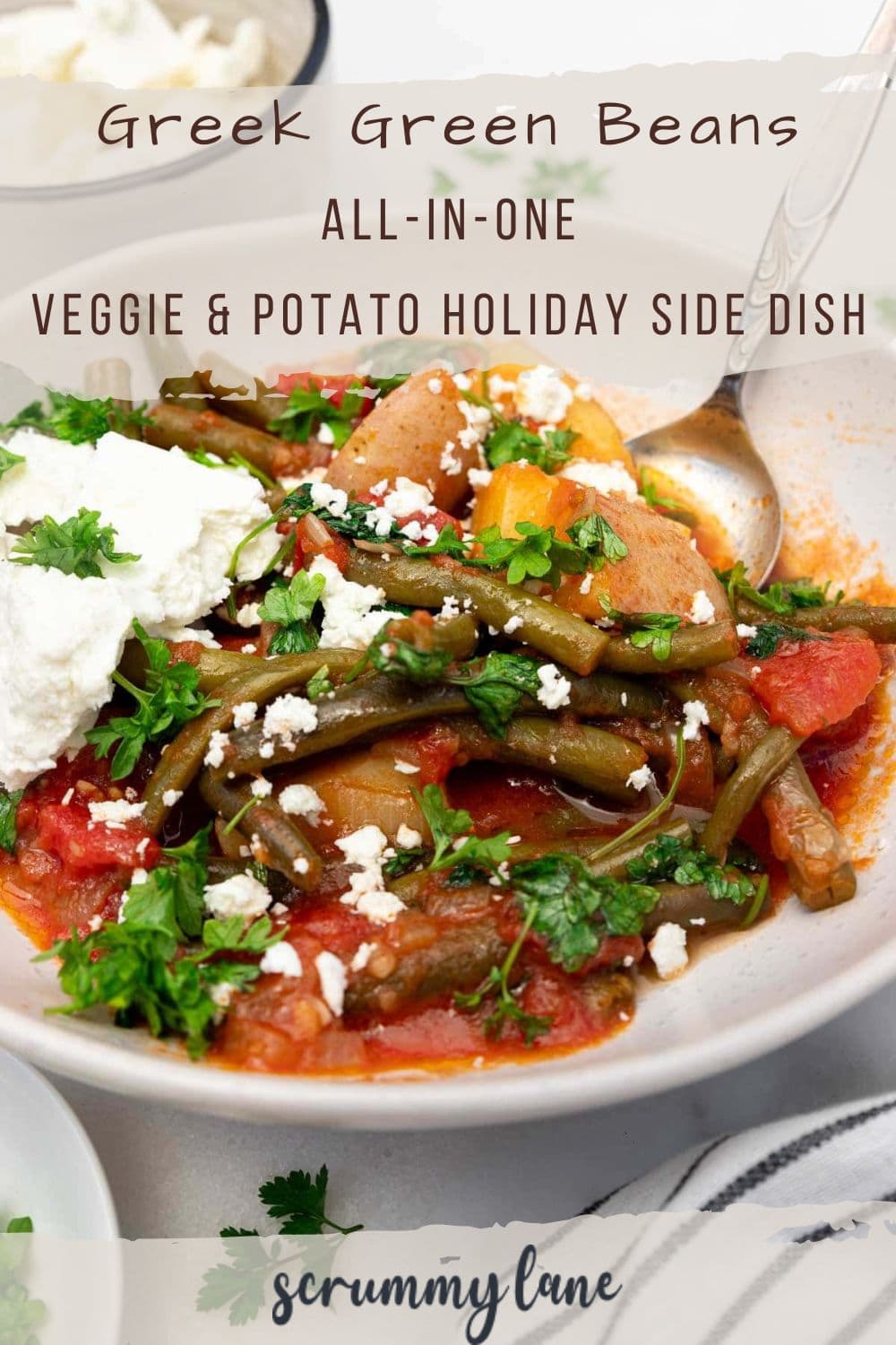 A white dish of Greek green beans with a title on it for Pinterest.