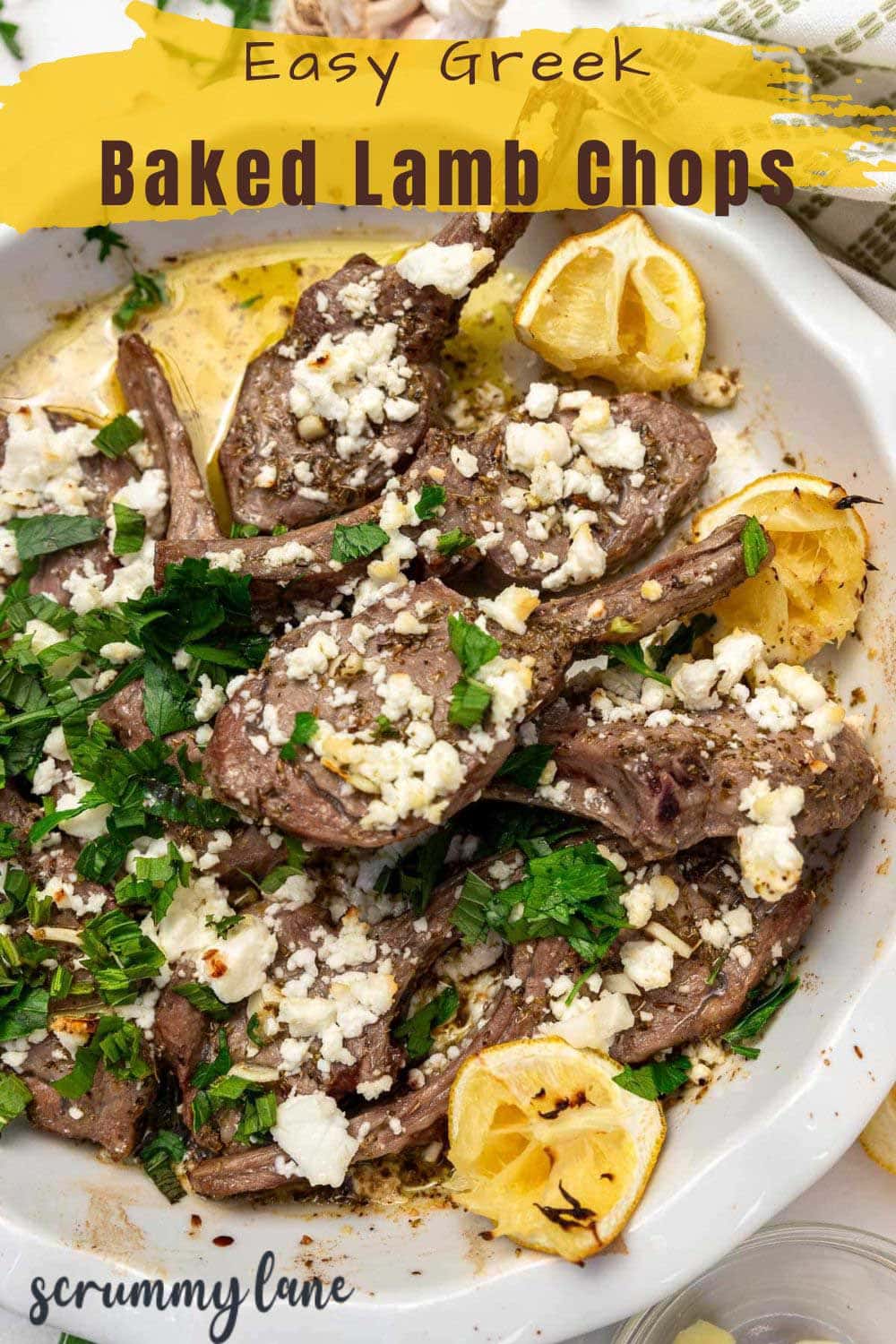 A Pinterest pin showing a closeup view of lamb chops with feta and herbs on top, and a title that says Easy Greek Baked Lamb Chops.