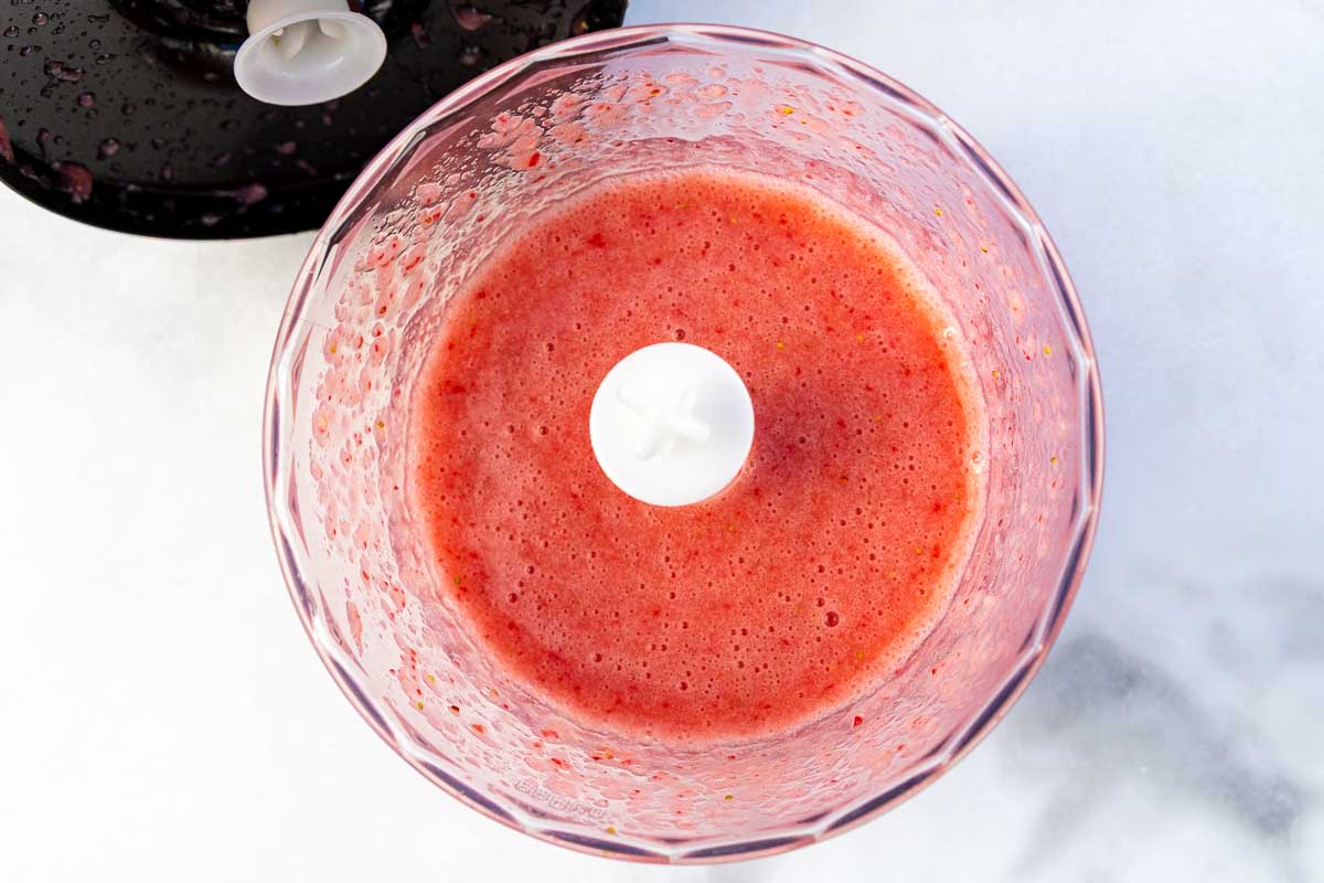 Overhead view of the puree in a small food processor.